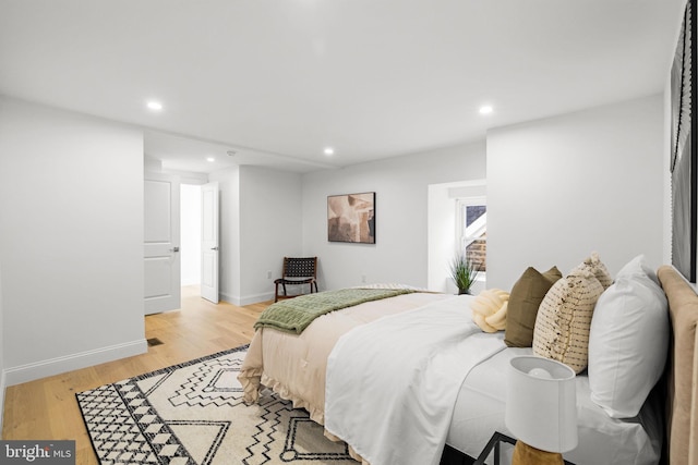 bedroom with light hardwood / wood-style flooring