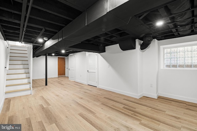 basement featuring light hardwood / wood-style floors