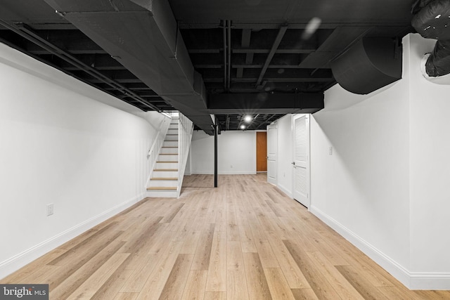 basement with light wood-type flooring