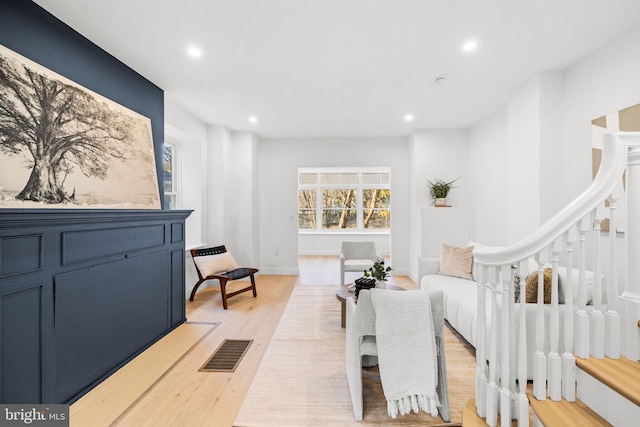 living room with light hardwood / wood-style floors