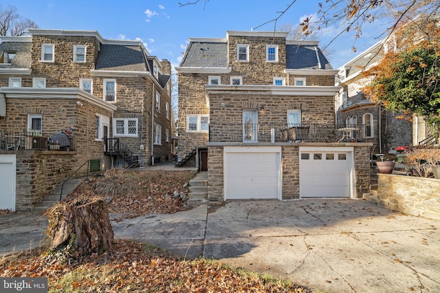 rear view of house with a garage