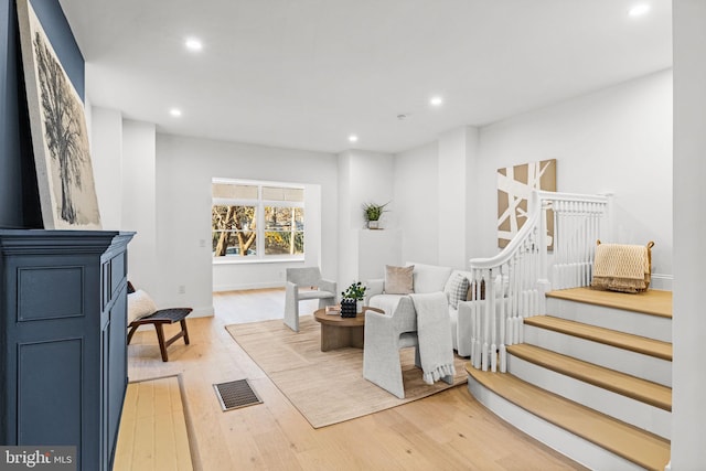 living room with light hardwood / wood-style flooring