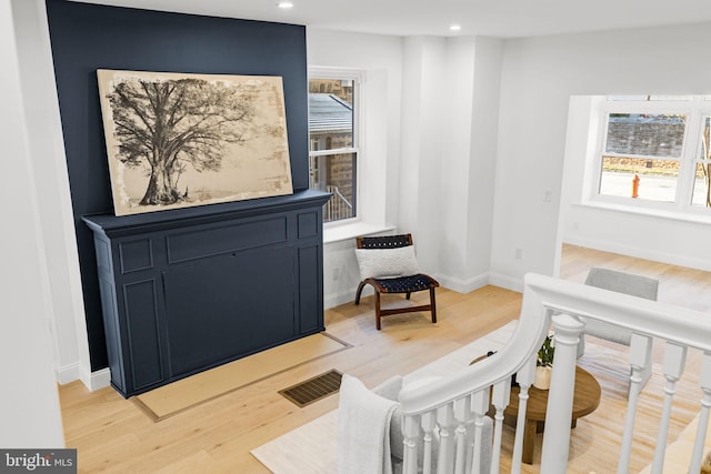 sitting room featuring light wood-type flooring