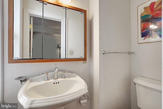 bathroom with toilet and sink