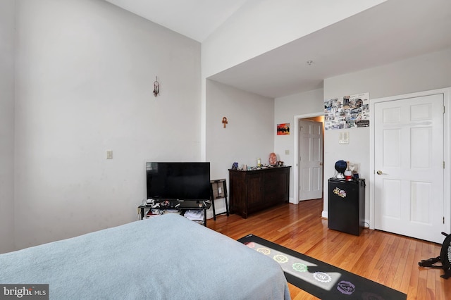 bedroom with hardwood / wood-style floors