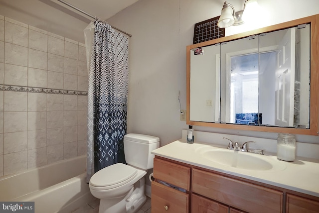 full bathroom featuring shower / bath combo, vanity, and toilet