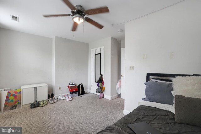 carpeted bedroom featuring ceiling fan