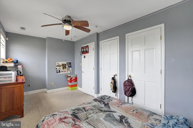 bedroom with ceiling fan and light colored carpet