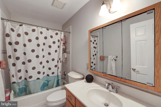 full bathroom featuring shower / tub combo, vanity, and toilet