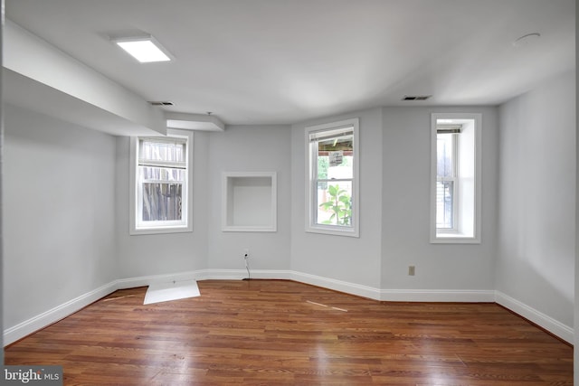 spare room with dark hardwood / wood-style flooring