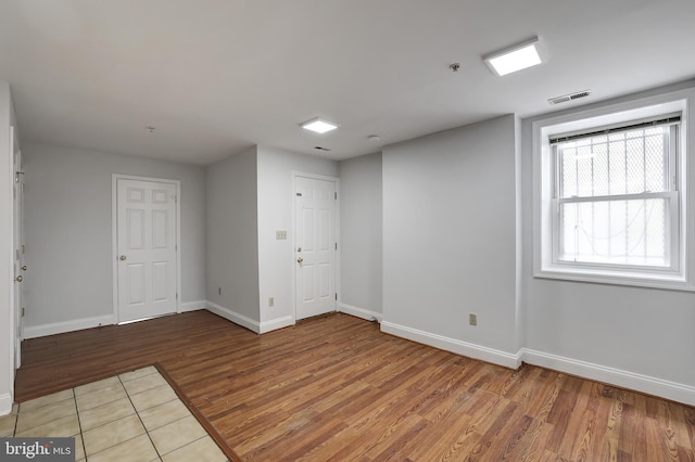 unfurnished room featuring hardwood / wood-style flooring