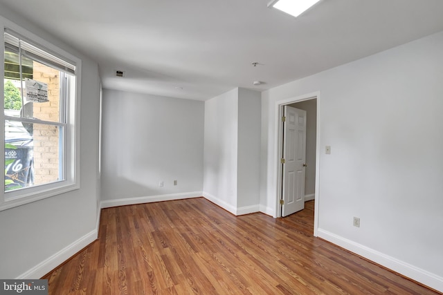 empty room featuring hardwood / wood-style floors