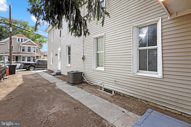 view of side of property featuring central AC unit