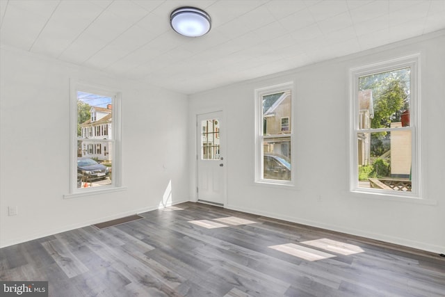 spare room featuring dark wood-type flooring