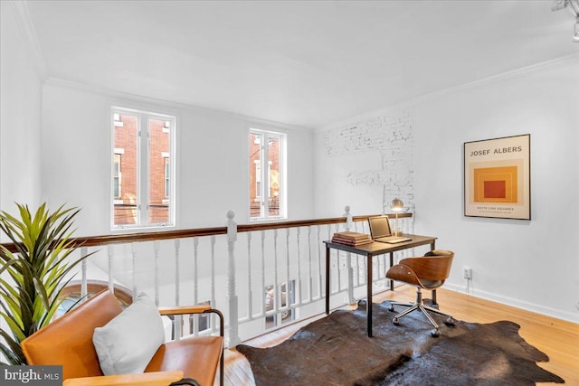 interior space featuring hardwood / wood-style floors and crown molding