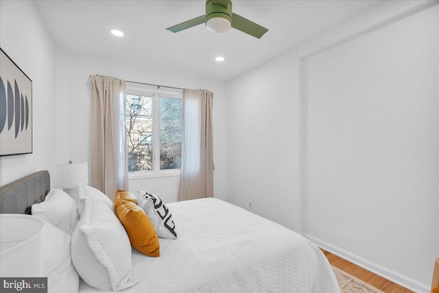 bedroom featuring hardwood / wood-style floors and ceiling fan