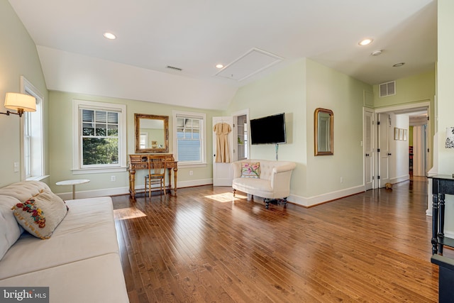 living room with vaulted ceiling and dark hardwood / wood-style floors