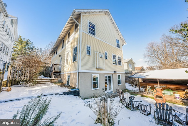 view of snow covered house