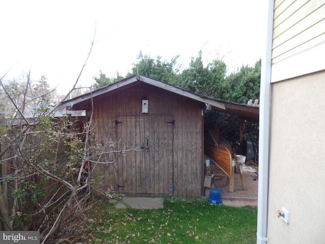 view of outdoor structure with a lawn