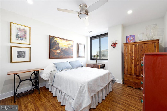 bedroom with ceiling fan and dark wood-type flooring