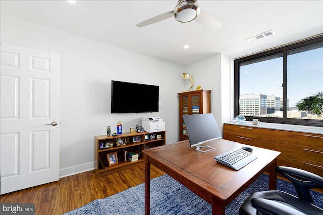 office area featuring ceiling fan and dark wood-type flooring