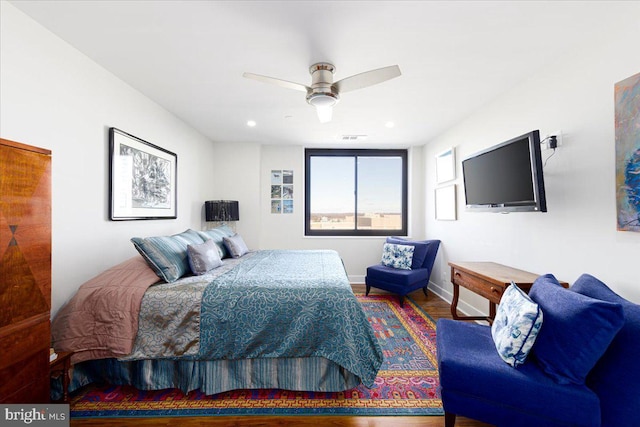 bedroom featuring hardwood / wood-style flooring and ceiling fan