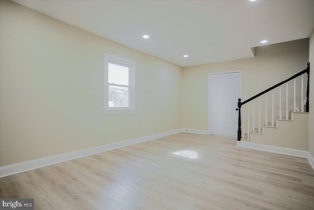 unfurnished room with light wood-type flooring