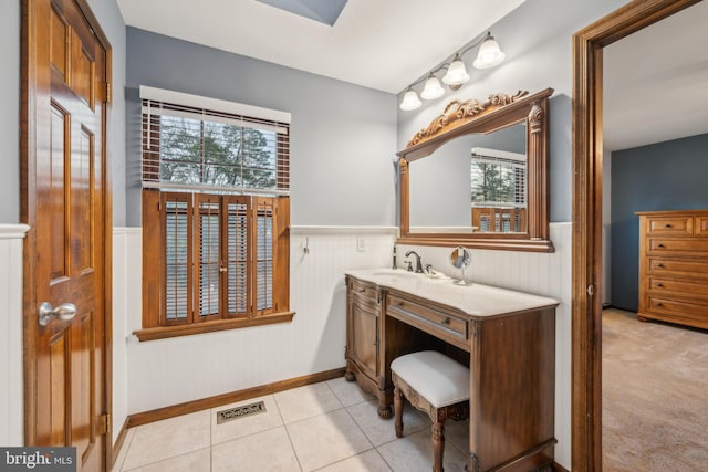 bathroom featuring tile patterned flooring and vanity