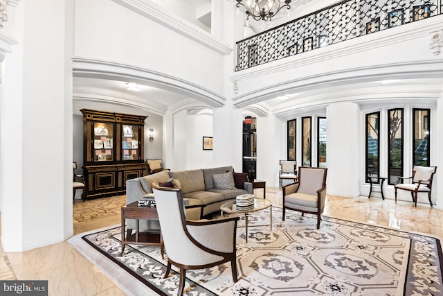 living room featuring a high ceiling and an inviting chandelier