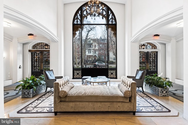 living area with an inviting chandelier