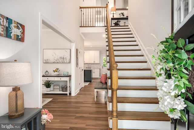 stairway featuring wood-type flooring