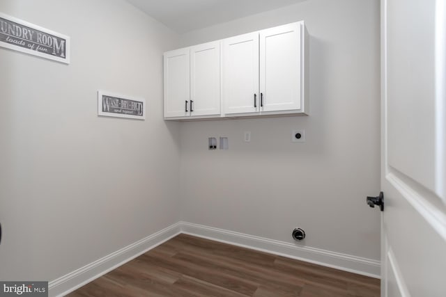 clothes washing area featuring cabinets, washer hookup, hookup for an electric dryer, and dark hardwood / wood-style flooring