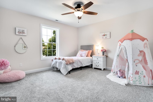 bedroom with ceiling fan and carpet flooring