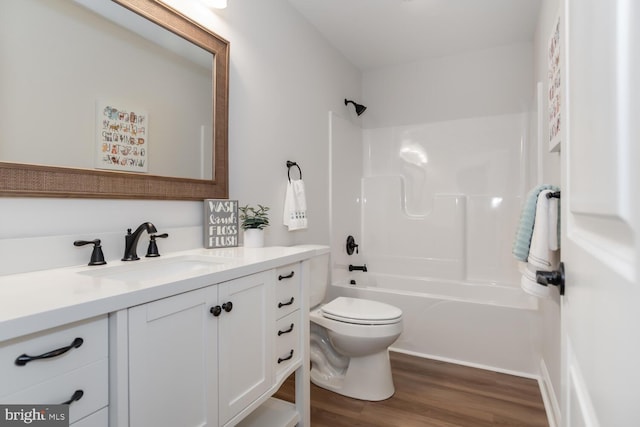 full bathroom featuring vanity, toilet, shower / bath combination, and hardwood / wood-style floors