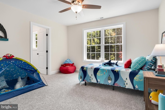 carpeted bedroom featuring ceiling fan