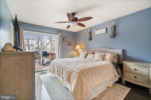 bedroom featuring access to exterior, ceiling fan, and dark hardwood / wood-style flooring