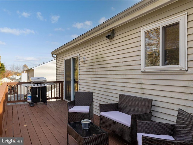 wooden terrace featuring grilling area