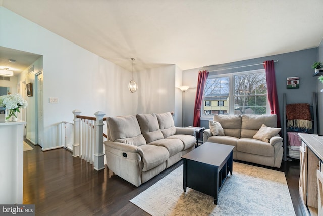 living room featuring dark hardwood / wood-style flooring