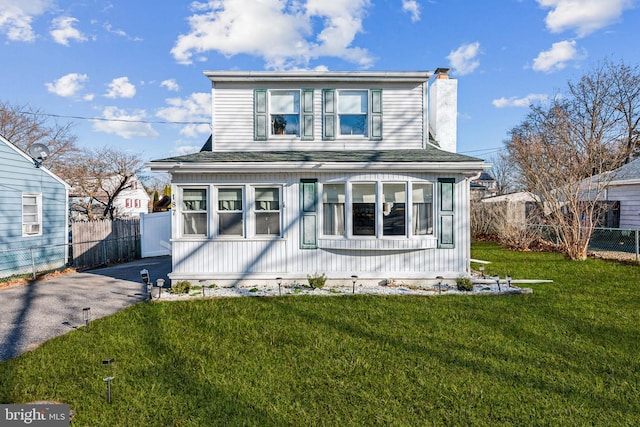 view of front of home with a front lawn