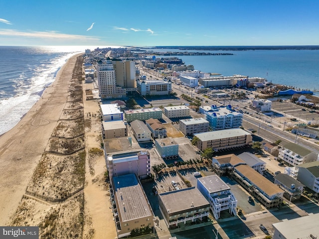 aerial view with a water view and a view of the beach