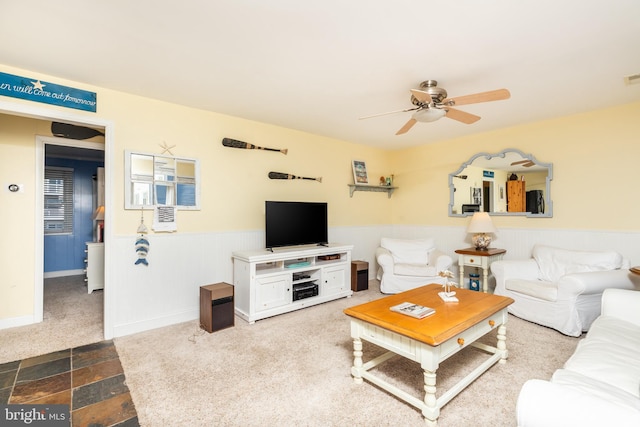 living room featuring ceiling fan and carpet floors