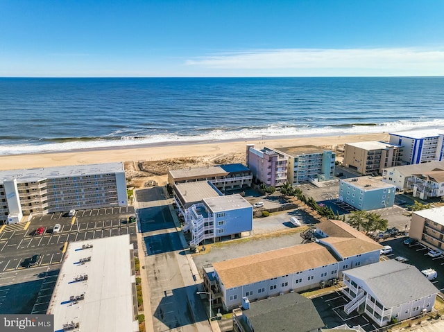 aerial view featuring a water view and a view of the beach