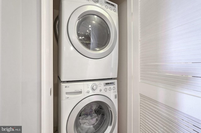 laundry room featuring stacked washer / dryer