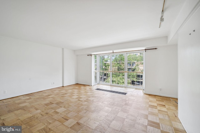 spare room featuring light parquet floors