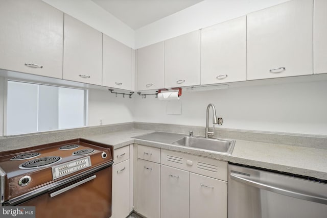 kitchen featuring white cabinets, dishwasher, range with electric stovetop, and sink