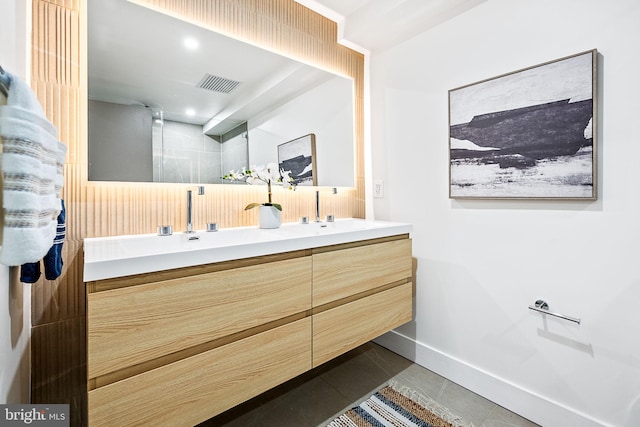 bathroom with tile patterned flooring and vanity