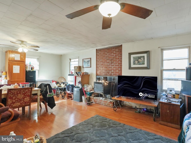 living room with a healthy amount of sunlight and wood-type flooring