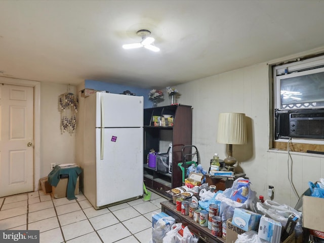 kitchen with cooling unit, light tile patterned floors, and white refrigerator