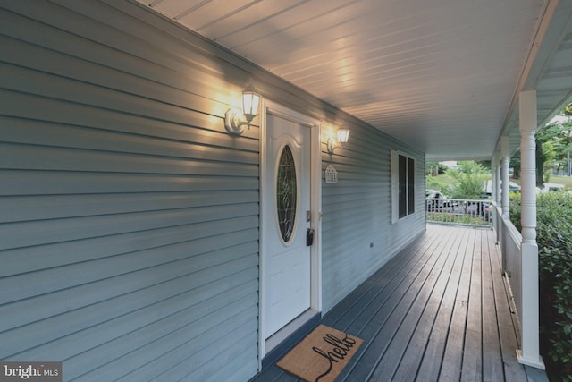 wooden deck featuring covered porch