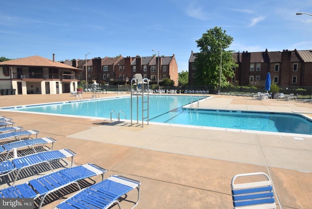 view of swimming pool featuring a patio